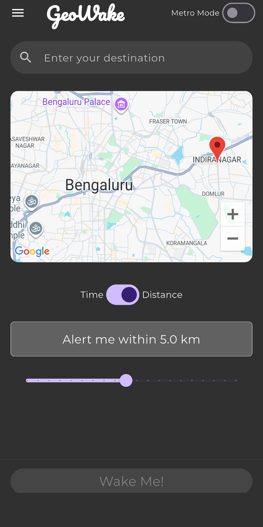 GeoWake home screen in dark mode: a destination search field, a map of Bengaluru with a dropped pin on Indiranagar, a Time/Distance toggle set to Distance, and a slider reading Alert me within 5.0 km.