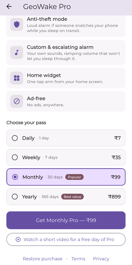 GeoWake Pro purchase screen showing four prepaid passes: Daily ₹7, Weekly ₹35, Monthly ₹99 marked Popular, and Yearly ₹899 marked Best value, plus an option to watch a short video for a free day of Pro.